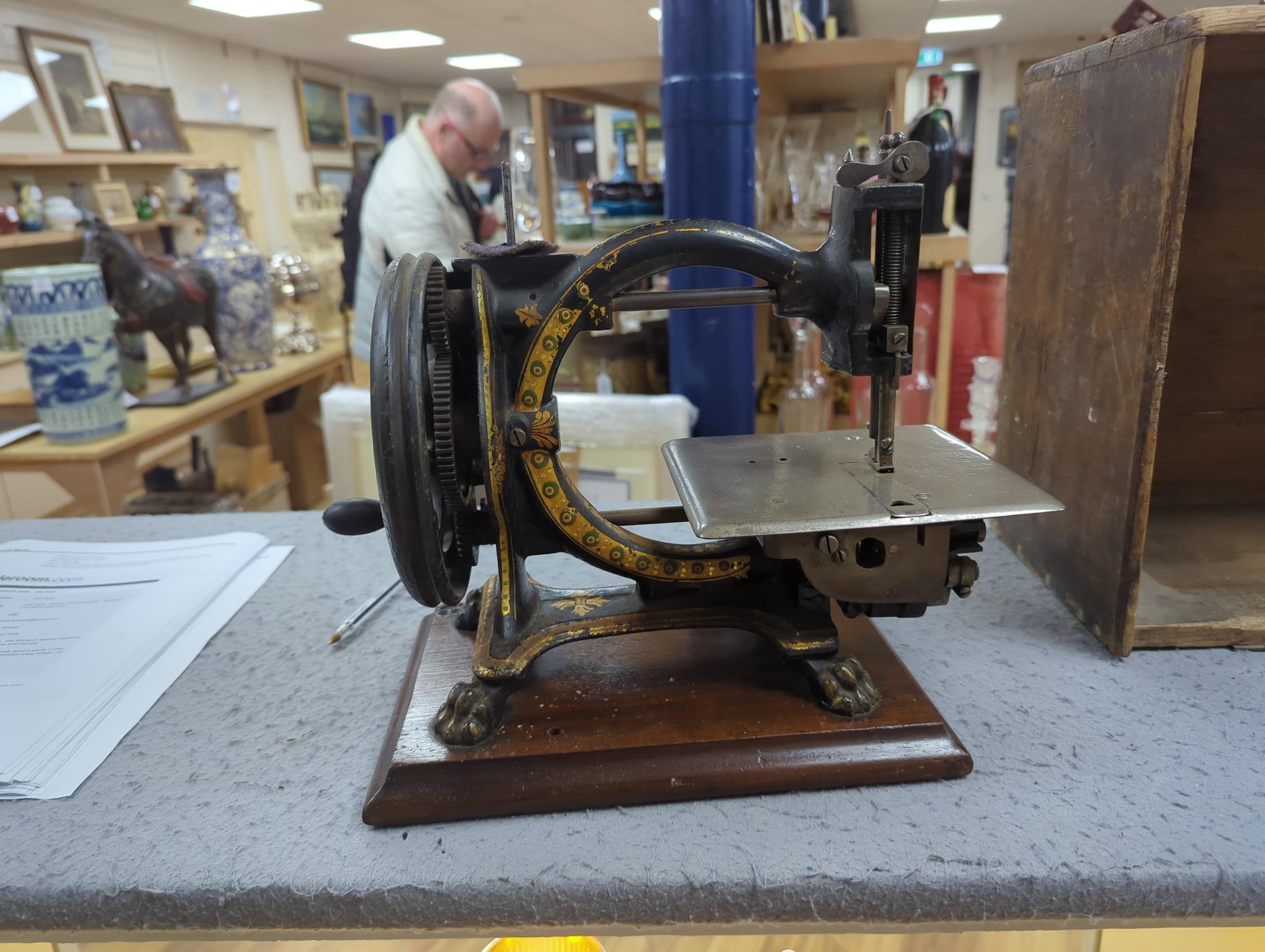 A Smith & Co. The Monarch sewing machine with original case and manual